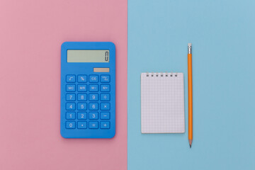 Notebook with pencil, calculator on pink blue background. Top view