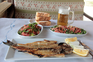 delicious fish and salads on presentation plate