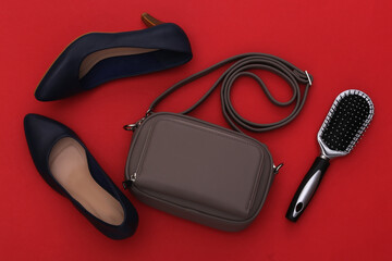 Women's fashion accessories on red background. Top view.