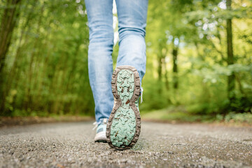close up of unbranded walking shoes, walking along a country road