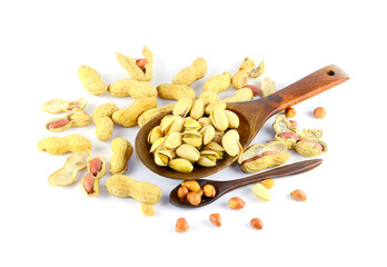 Many nuts are mixed in a wooden spoon of different sizes on a white background.