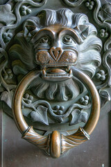 Lion head door knocker made of brass at Hohenzollern Castle, Germany