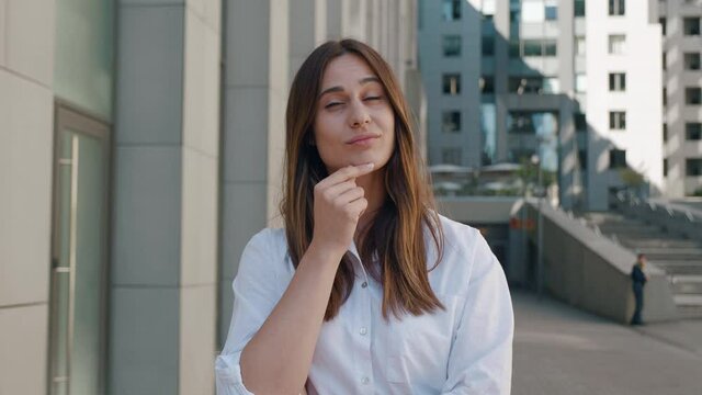 Smart thoughtful beautiful woman with brown hair in white shirt pondering and being inspired by sudden solution, surprised by genius idea in mind, got answer. business center background 4k