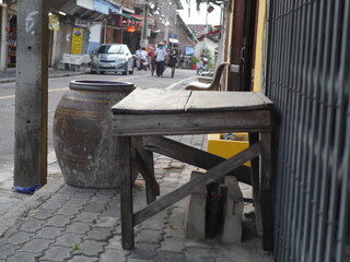 Old brown wooden table with old style blister on the roadside