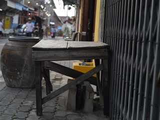 Old brown wooden table with old style blister on the roadside