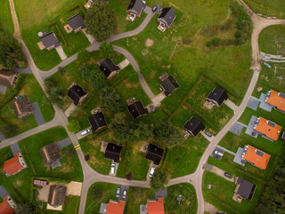 Meandering alley through a bungalow park summer homes with various style houses and rooftops