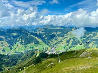 Fototapeta premium View on Saalbach village and mountains in Saalbach-Hinterglemm skiing region in Austria on a beautiful summer day.