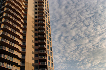 Fototapeta premium Building with windows against clouds