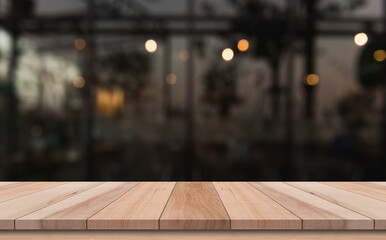 Wooden top table with bokeh light effect and blur restaurant on background, blur background
