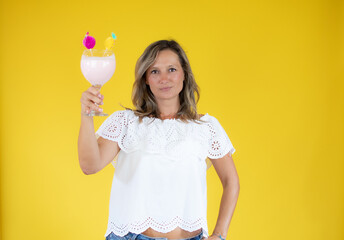 Beautiful woman in white shirt showing a shake