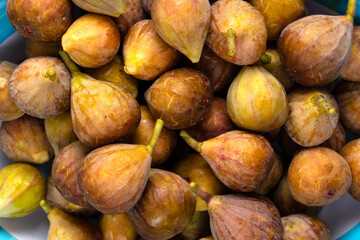 Fresh ripe figs as background, top view. Tropical fruit.