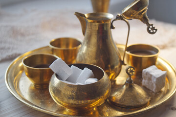 Delicious Bosnian coffee is served with rahat lokum dessert in traditional turkish coffee pot