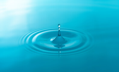 Naklejka na ściany i meble Close-up blue water drops isolated on white background.