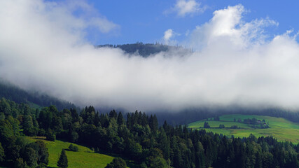 beautiful morning with sun and fog in the mountains