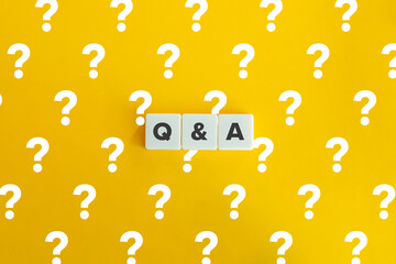 Questions and Answers (Q&A) Banner. Block letters on bright yellow orange background with the...