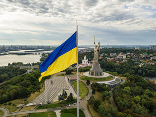 Aerial drone view. Ukrainian flag on a high flagpole in Kiev.