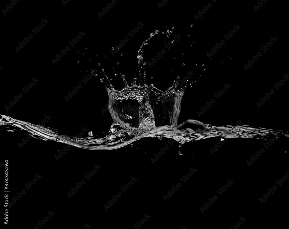 Wall mural close up of water splash and bubbles isolated on black background