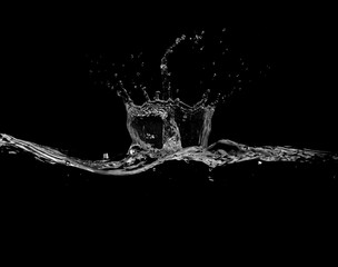 close up of water splash and bubbles isolated on black background