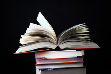 Open book on the table. It is time for education and therefore you need to go back to school.