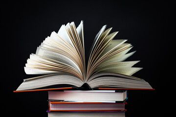 Open book on the table. It is time for education and therefore you need to go back to school.