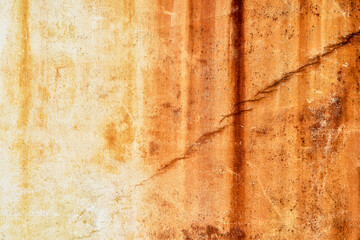 Outdoor cement wall stained with rust.