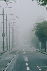 Street with fog around the public transport