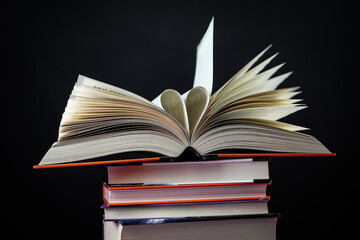 Open book on the table. It is time for education and therefore you need to go back to school.