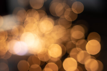 Gold abstract bokeh background, Festive xmas abstract background with bokeh defocused lights and stars
