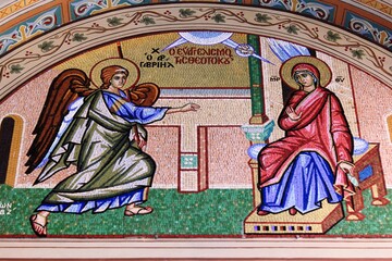 Beautiful mosaic showing  the Annunciation to the Virgin Mary outside of  Christian orthodox church - Athens, Greece, August 11 2020.