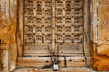 Jaisalmer, India - August 2020: Detail of a door of a haveli in Jaisalmer Fort on August 20, 2020 in Jaisalmer, Rajasthan, India.