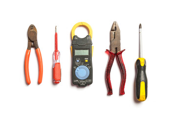 Top view of Working tools for electrician,hammer,screwdriver,plier,electric drill, measure,on white background.