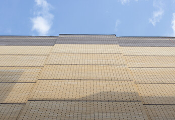 Industrial background, brick wall of a high-rise building