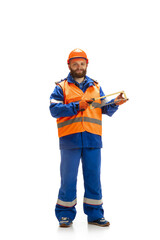 Handsome contractor, builder isolated over white studio background. Concept of professional occupation, work, job, building, investment. Copyspace for ad, text. Caucasian man wearing equipment.