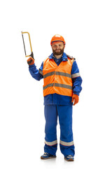Handsome contractor, builder isolated over white studio background. Concept of professional occupation, work, job, building, investment. Copyspace for ad, text. Caucasian man wearing equipment.