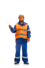 Handsome contractor, builder isolated over white studio background. Concept of professional occupation, work, job, building, investment. Copyspace for ad, text. Caucasian man wearing equipment.