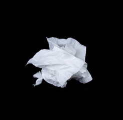 Crumpled tissue paper isolated on black background texture