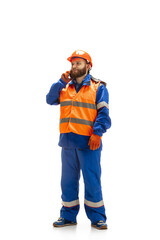 Handsome contractor, builder isolated over white studio background. Concept of professional occupation, work, job, building, investment. Copyspace for ad, text. Caucasian man wearing equipment.