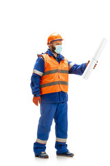 Handsome contractor, builder in face mask isolated over white studio background. Concept of professional occupation, work, job, building, investment. Copyspace for ad, text. Caucasian man wearing