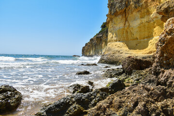 Fototapeta na wymiar Rocks and waves in the Mediterranean Sea, Cala fonda, Tarragona.