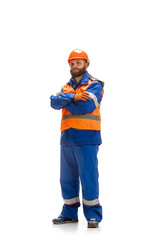 Handsome contractor, builder in face mask isolated over white studio background. Concept of professional occupation, work, job, building, investment. Copyspace for ad, text. Caucasian man wearing