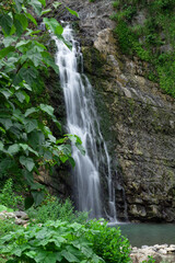 Fototapeta na wymiar High mountain with a waterfall.Mountain landscape in summer