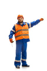 Handsome contractor, builder in face mask isolated over white studio background. Concept of professional occupation, work, job, building, investment. Copyspace for ad, text. Caucasian man wearing