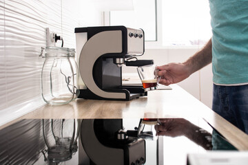 Man preparing coffee at home