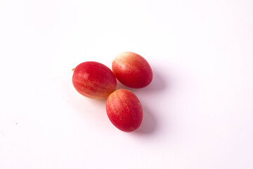 Mango yawn with 3 lime fruits on white background.