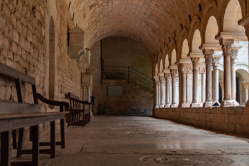 Fototapeta premium Old arched corridor in a cathedral