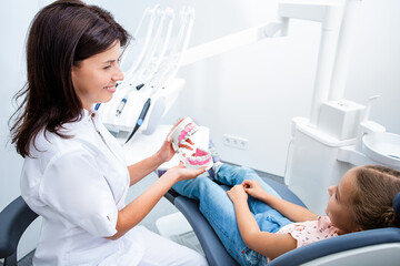 Happy dentist and child communicate, Teeth treatment child. Child's dentist while working