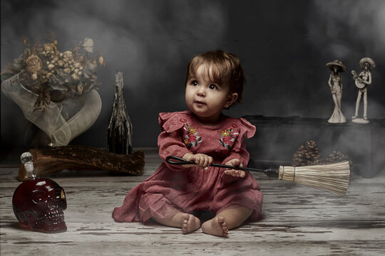 One Year Old Baby Dressed As A Witch For Halloween