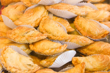Curry puff is a snack of southeast asian .Made by a small pie consisting of curry with chicken and potatoes.