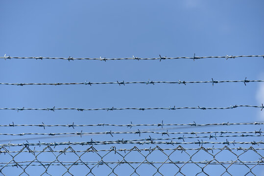 Barbed wire fences around prisons Used to prevent prisoners from escaping From being arrested Detention in prison