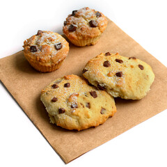 Homemade delicious cookies of various shapes lie on craft paper